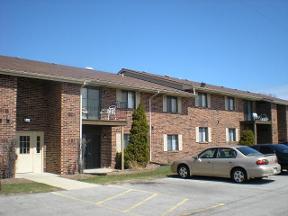 Cars Parked In Front Of Apartment